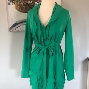 Women’s green ruffle tie jacket.